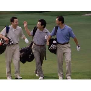 Three Men Carrying Golf Bags at a Golf Course Photographic 