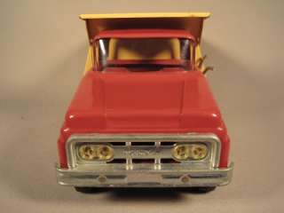   paint. Truck is red with yellow dump bed A super near mint truck