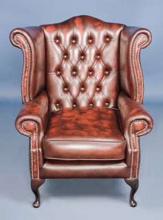 Here is the wing back arm chair, a classic buttoned leather piece.