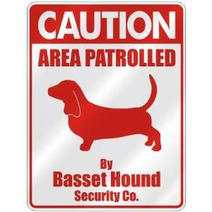 CAUTION  AREA PATROLLED BY BASSET HOUND SECURITY CO.  PARKING SIGN 