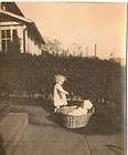 Old Vintage Photograph Little Baby With Doll in Laundry Basket