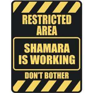   RESTRICTED AREA SHAMARA IS WORKING  PARKING SIGN