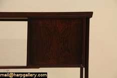   gloriously grained rosewood, this desk has a superb gleaming finish