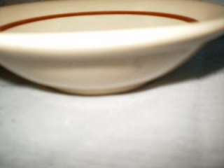 , beige, brown lined, berry, dish. The dish is marked Cafe Ware 